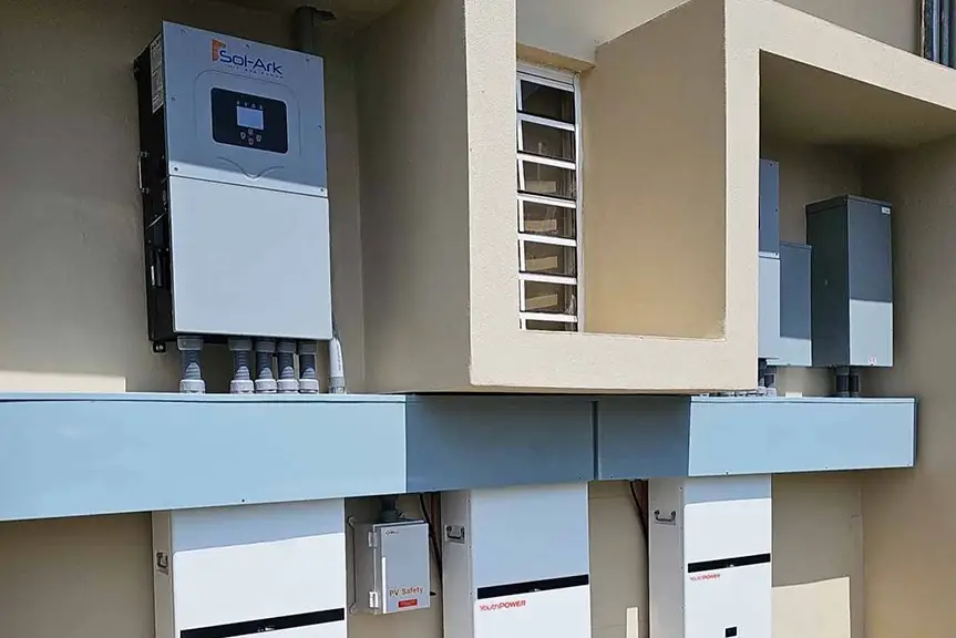 Battery Bank Installation With Multiple Solar Inverters Mounted on Wall
