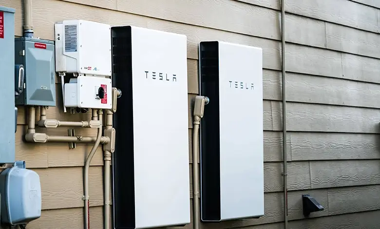 Two Wall-Mounted Battery Banks Next to Electrical Panels