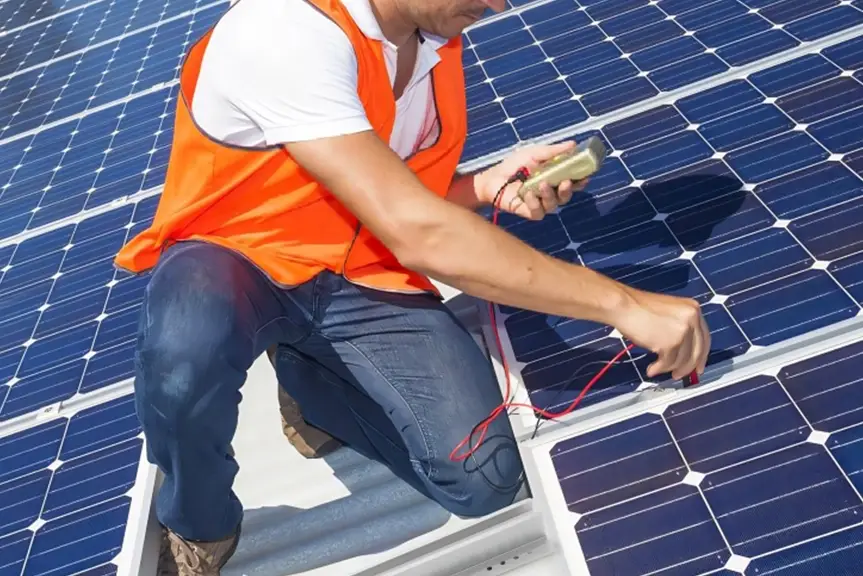 Technician Performing Solar Panel Upgrades on Rooftop Installation