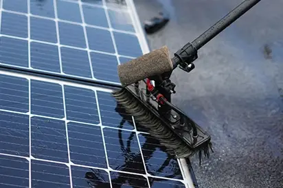 Brush Cleaning Solar Panels For Optimal Performance